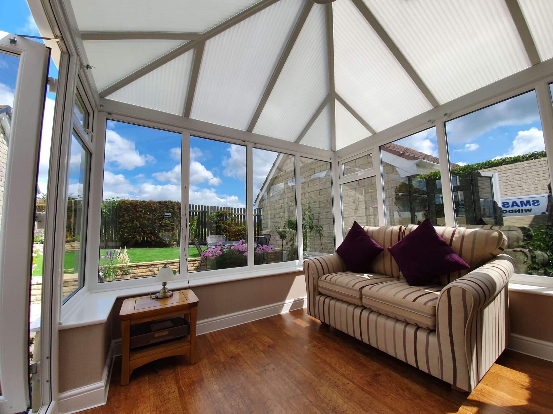living area with polycabornate plastic roof
